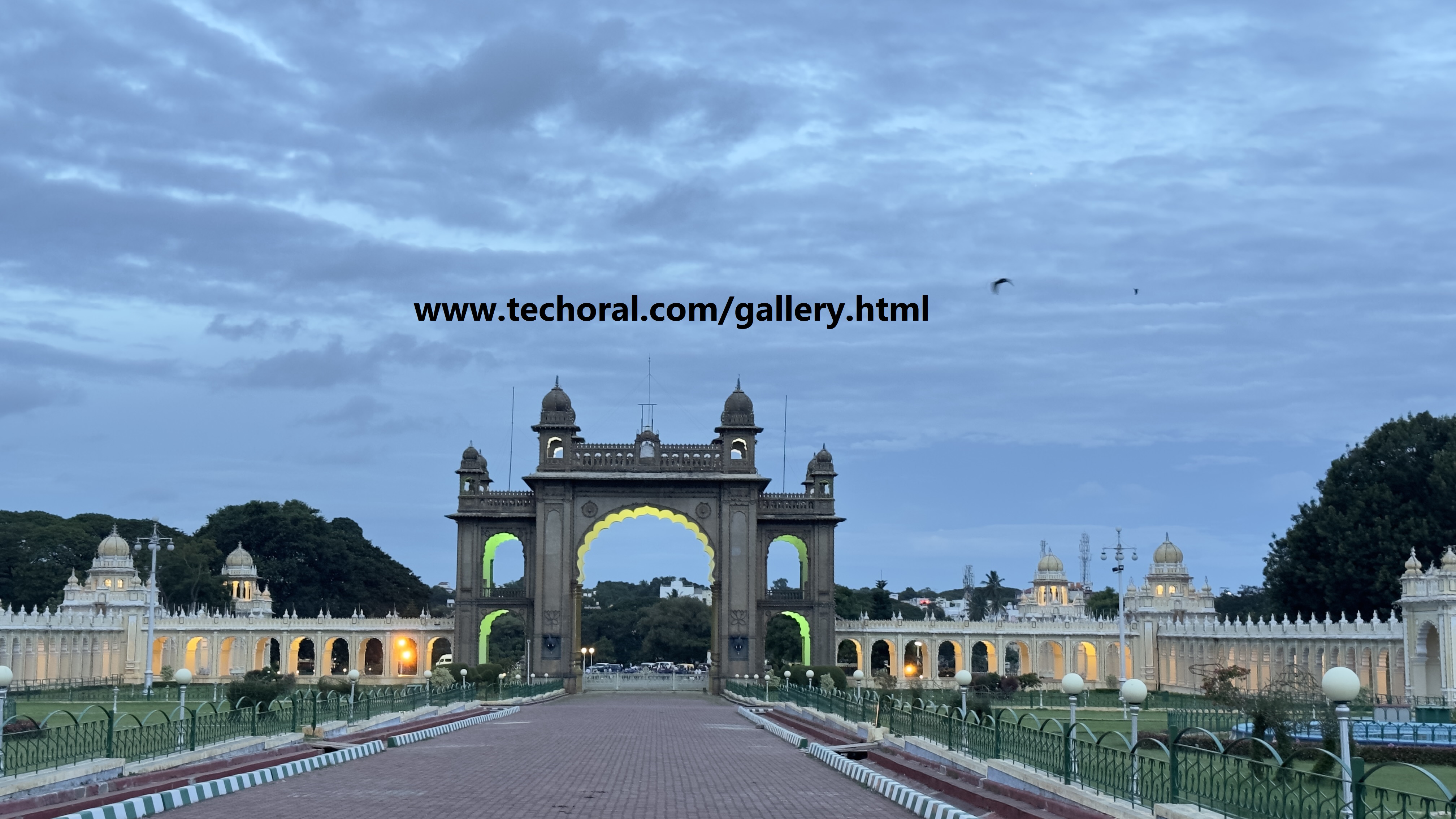 Ornate palace gate adorned with intricate carvings and vibrant colors, welcoming visitors into a realm of regal splendor and historical charm